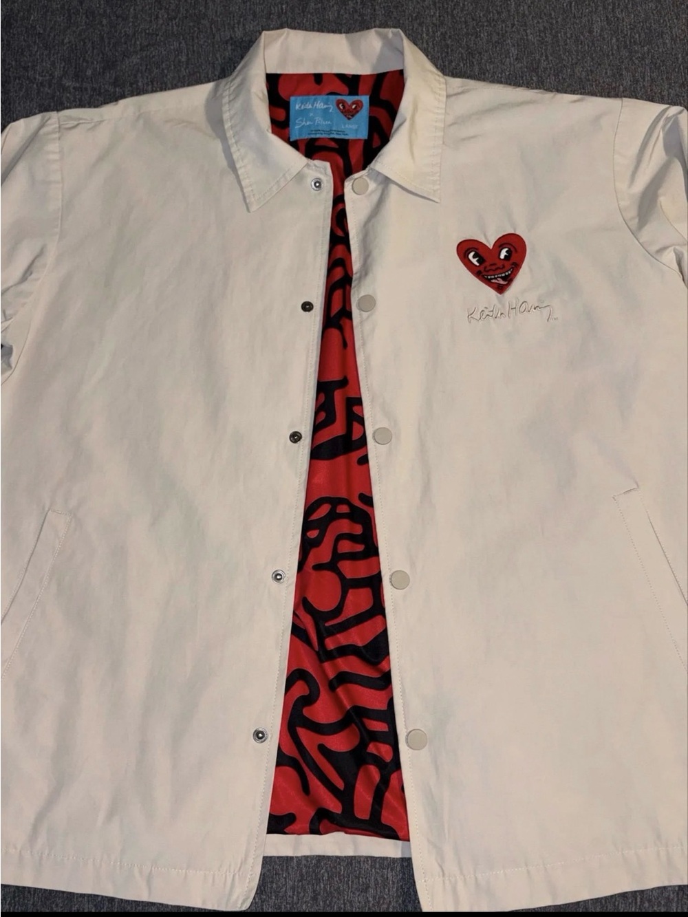 PALACE White Coach Jacket with Red Heart Patch & Black-Patterned Lining
